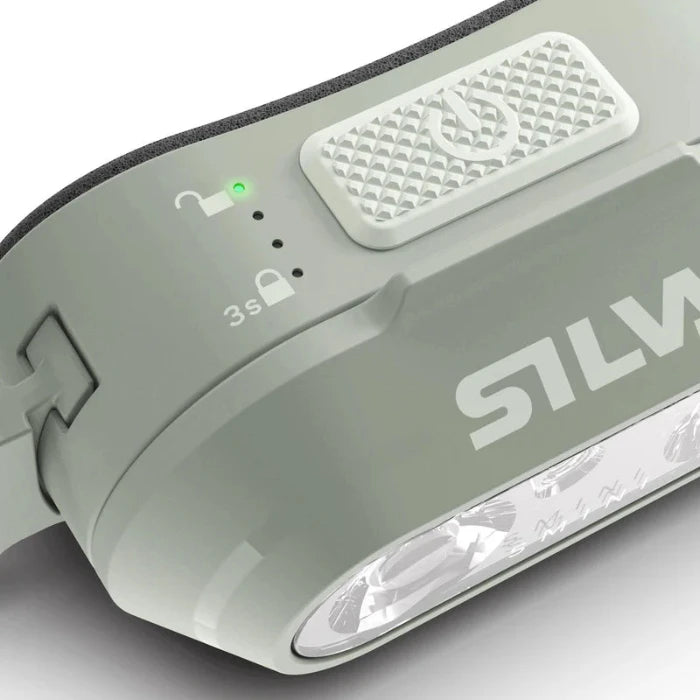 Silva Smini Fly Headtorch in mint close up of lock button. 